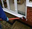 Cleaning doorstep of PVCu door - windows and frames get cleaned at the same time